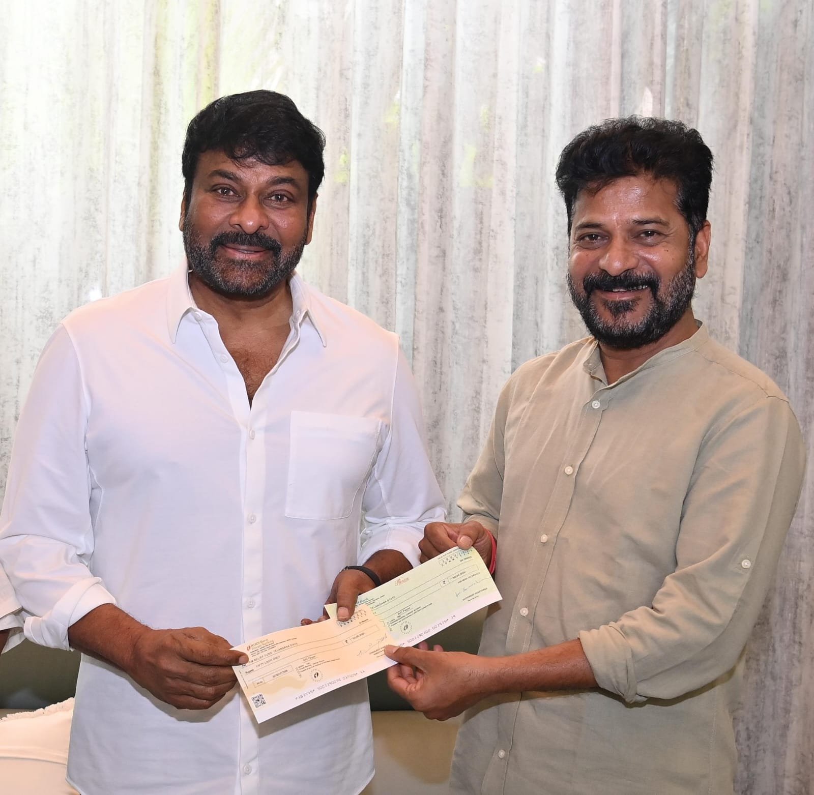 Alt Name: Chiranjeevi Donation to CM Relief Fund for Flood Victims