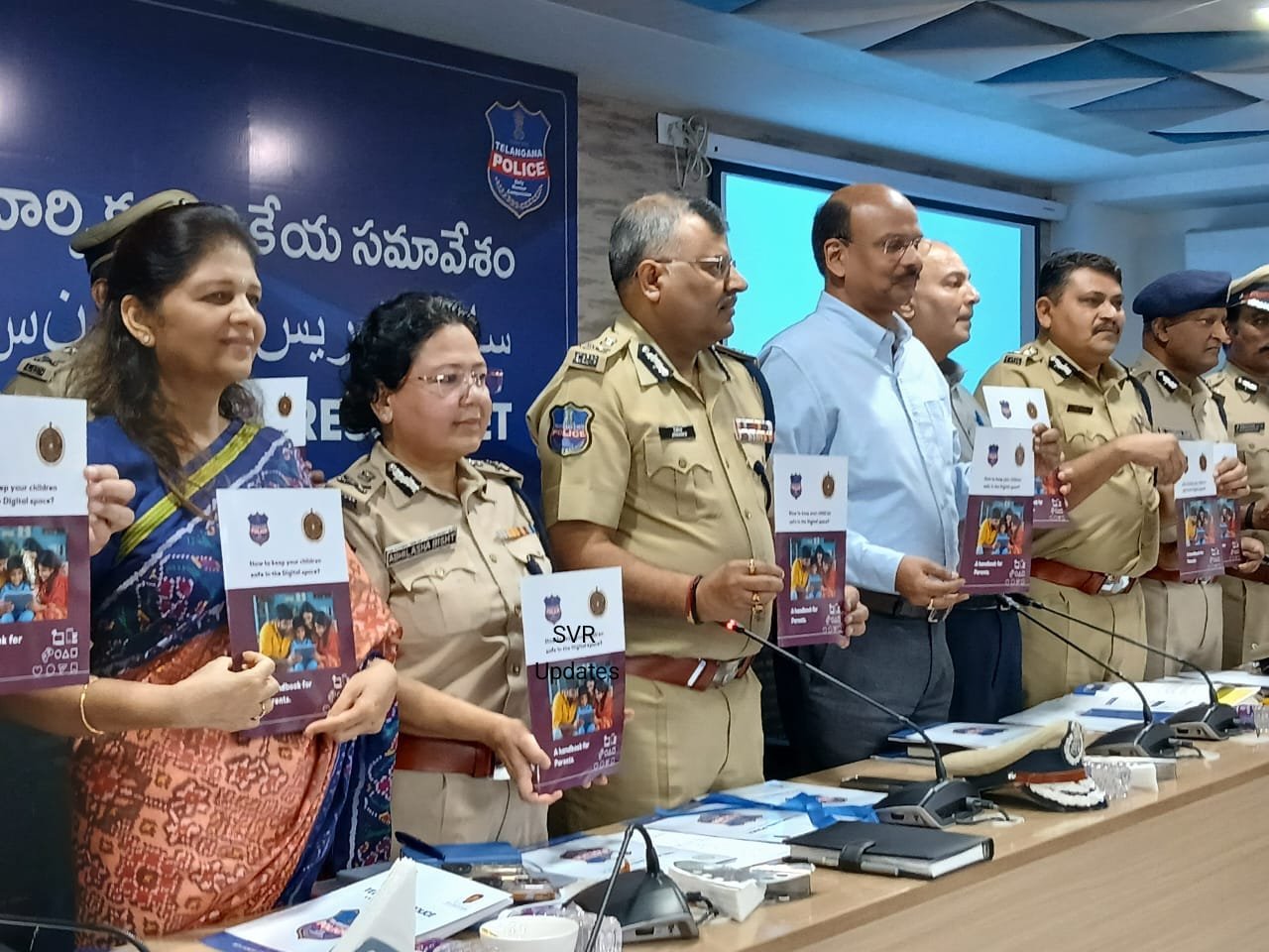 Telangana DGP Jitender presenting the 2024 Annual Report with senior police officials.