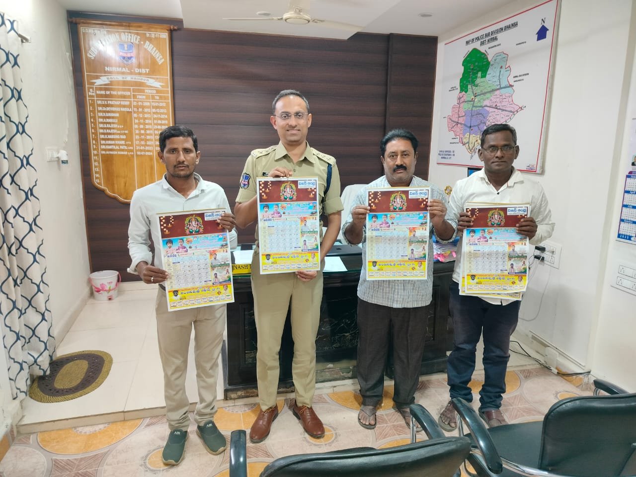 Vision Andhra 2025 Calendar Launch by ASP Avinash at Bhainsa Police Station